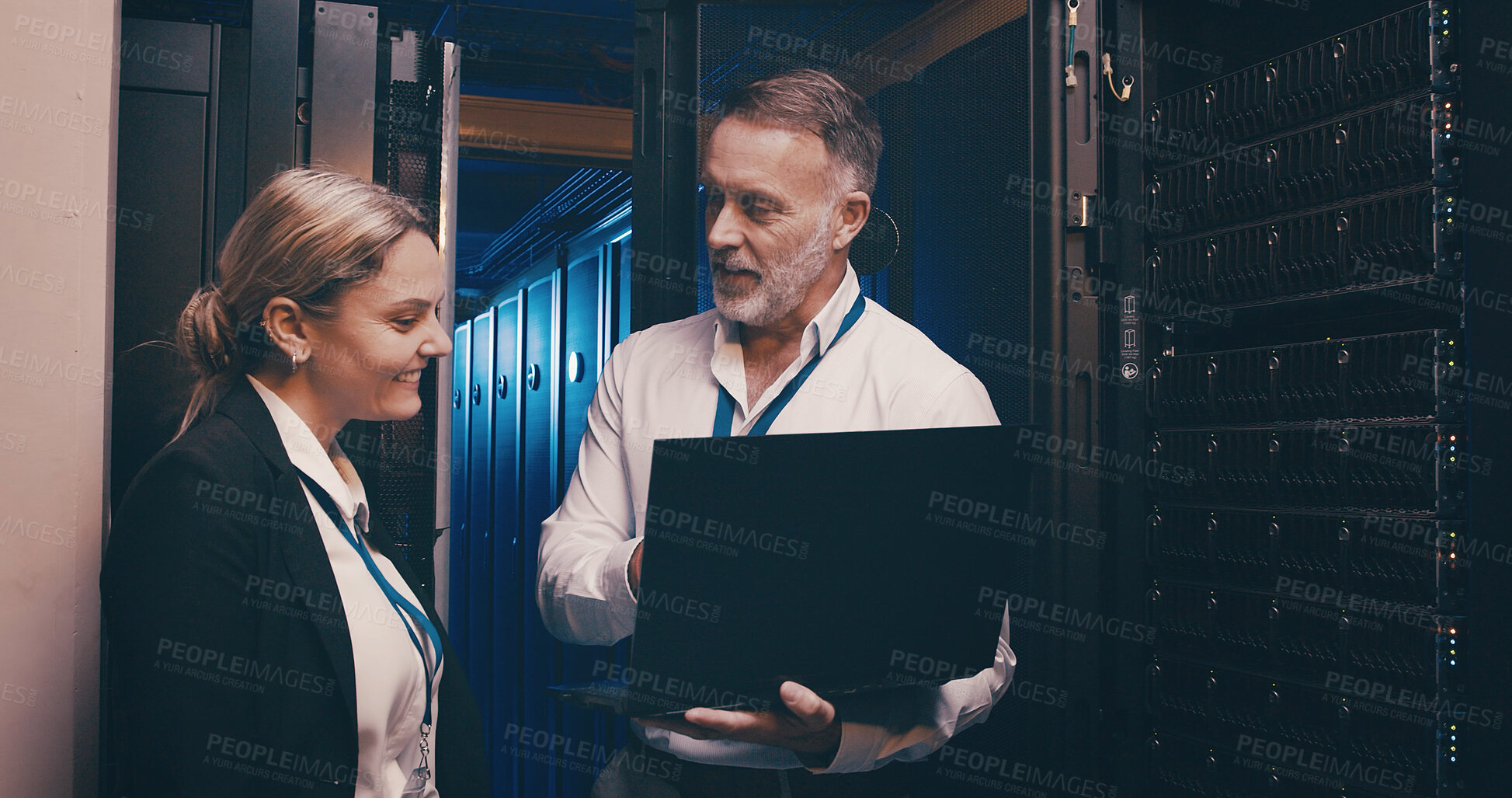 Buy stock photo Server room, meeting and people on laptop for network maintenance, IT support and database. Cybersecurity, technician team and man with woman on computer for diagnostics, system update and hardware