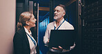 Server room, talking and people on laptop for database, network maintenance and IT support. Cybersecurity, technician team and man with woman on computer for diagnostics, system update and backup