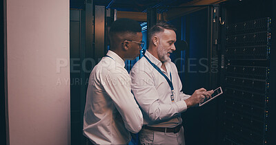 Buy stock photo Men, tablet and team in server room with maintenance, review and talk with mentor for system upgrade. People, tech and assessment with app, software update or programming for cybersecurity solution