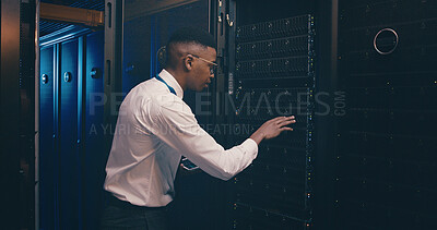 Buy stock photo Black man, tablet and inspection in server room with cybersecurity, system and hardware check. African programmer, tech and application with software update, assessment and storage at data center