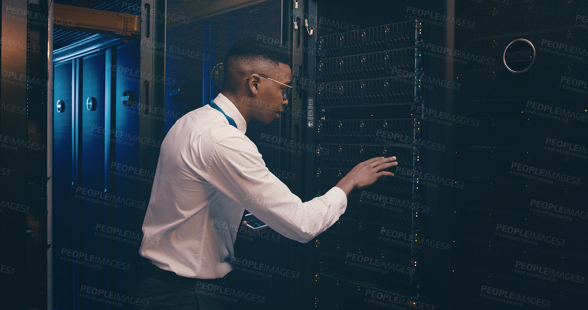 Buy stock photo Black man, tablet and inspection in server room with cybersecurity, system and hardware check. African programmer, tech and application with software update, assessment and storage at data center