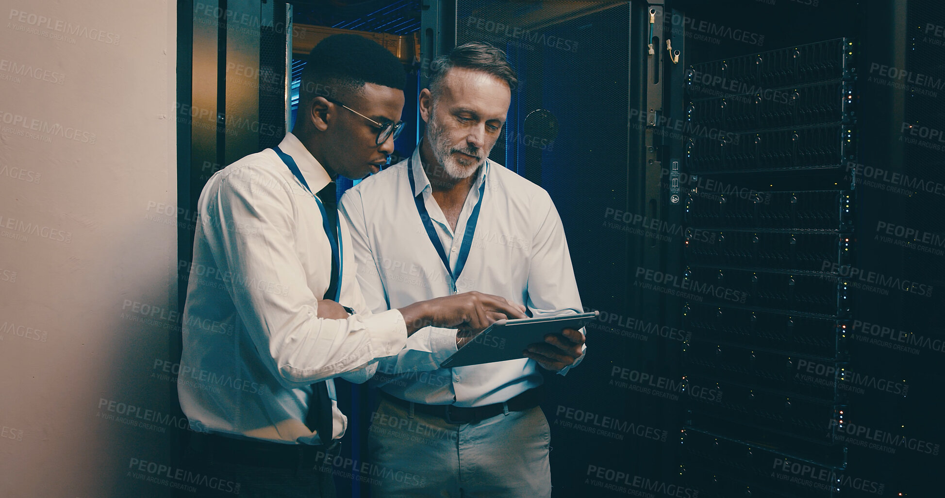 Buy stock photo Server room, team and people on tablet for IT support, database backup and cybersecurity. Meeting, hardware and workers on digital tech for system maintenance, diagnostics test and technical service