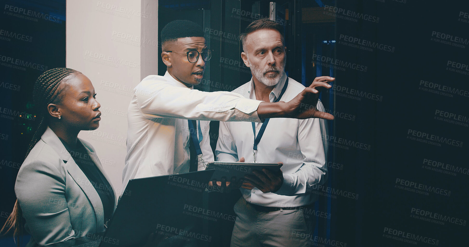 Buy stock photo Man, tablet and group with discussion in server room with cybersecurity, system and hardware check. Programmer, tech and team with app for software update, assessment and IT solution at data center