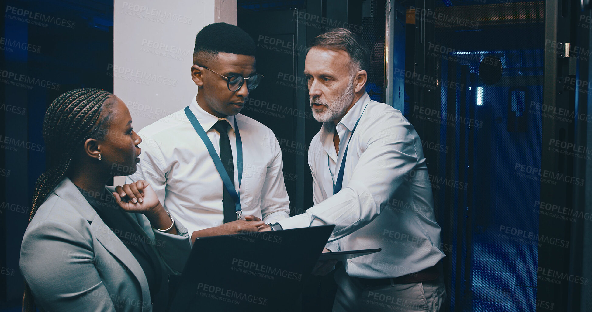 Buy stock photo Talking, network and business people on laptop in server room for cybersecurity, diagnostics IT support. Team, meeting and workers on tech, online and hardware for system update, database or backup