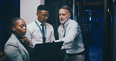 Buy stock photo Man, laptop and group with discussion in server room with cybersecurity, system or collaboration. Programmer, tech and team with insight for problem solving, assessment or IT solution at data center
