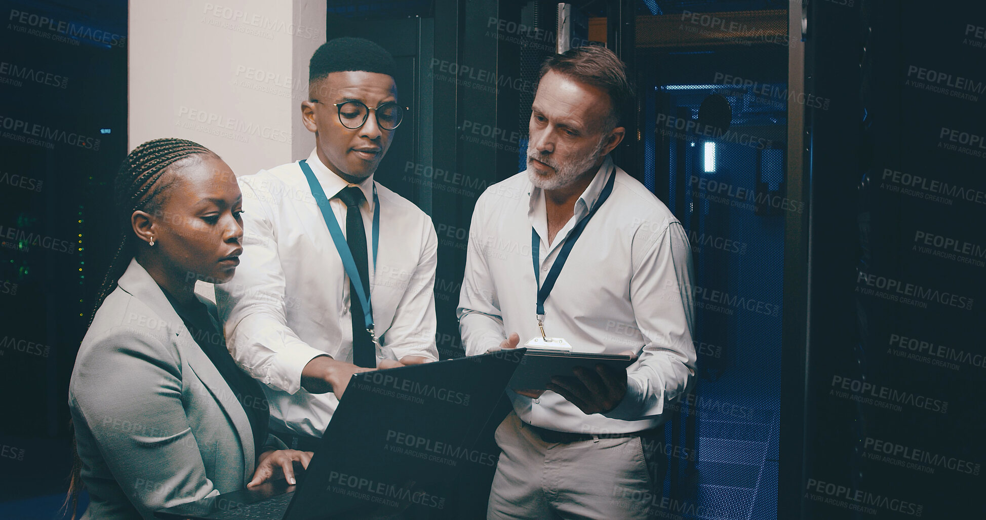 Buy stock photo Talking, network and people with tech in server room for cybersecurity, diagnostics and IT support. Team, meeting and workers on laptop, tablet and hardware for system update, database and backup