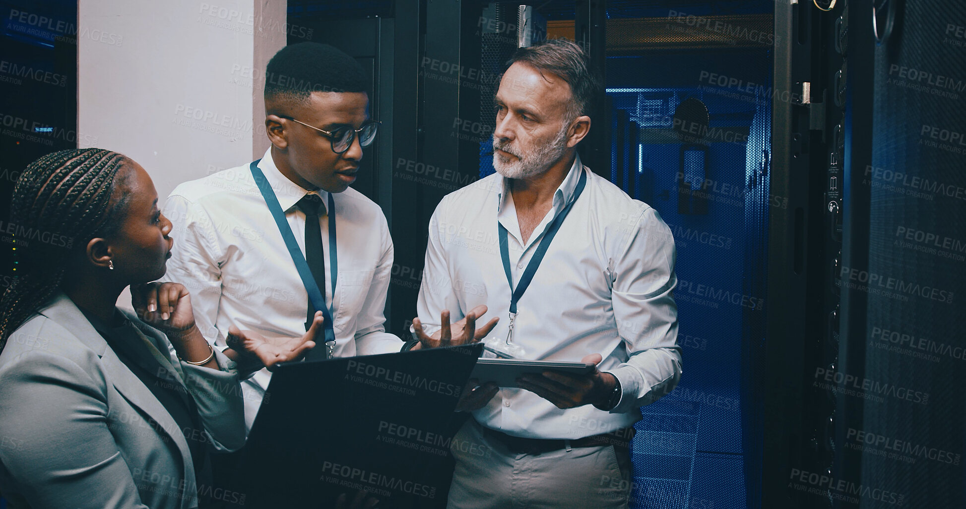 Buy stock photo Talking, network and people with laptop in server room for cybersecurity, diagnostics and IT support. Team, meeting and workers on tech, tablet and hardware for system update, database and backup