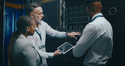 Buy stock photo Man, tablet and team with maintenance in server room with cybersecurity, system check or collaboration. Programmer, tech and group with advice for programming, review or IT solution at data center