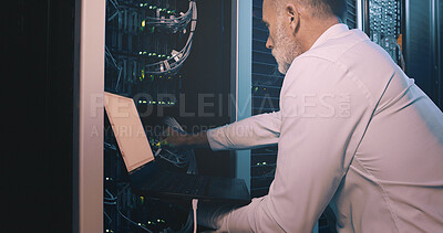 Buy stock photo Man, laptop and cable connection in server room for diagnostics, system test or maintenance. Engineer, mature person and tech in data center for network configuration, firewall installation or backup