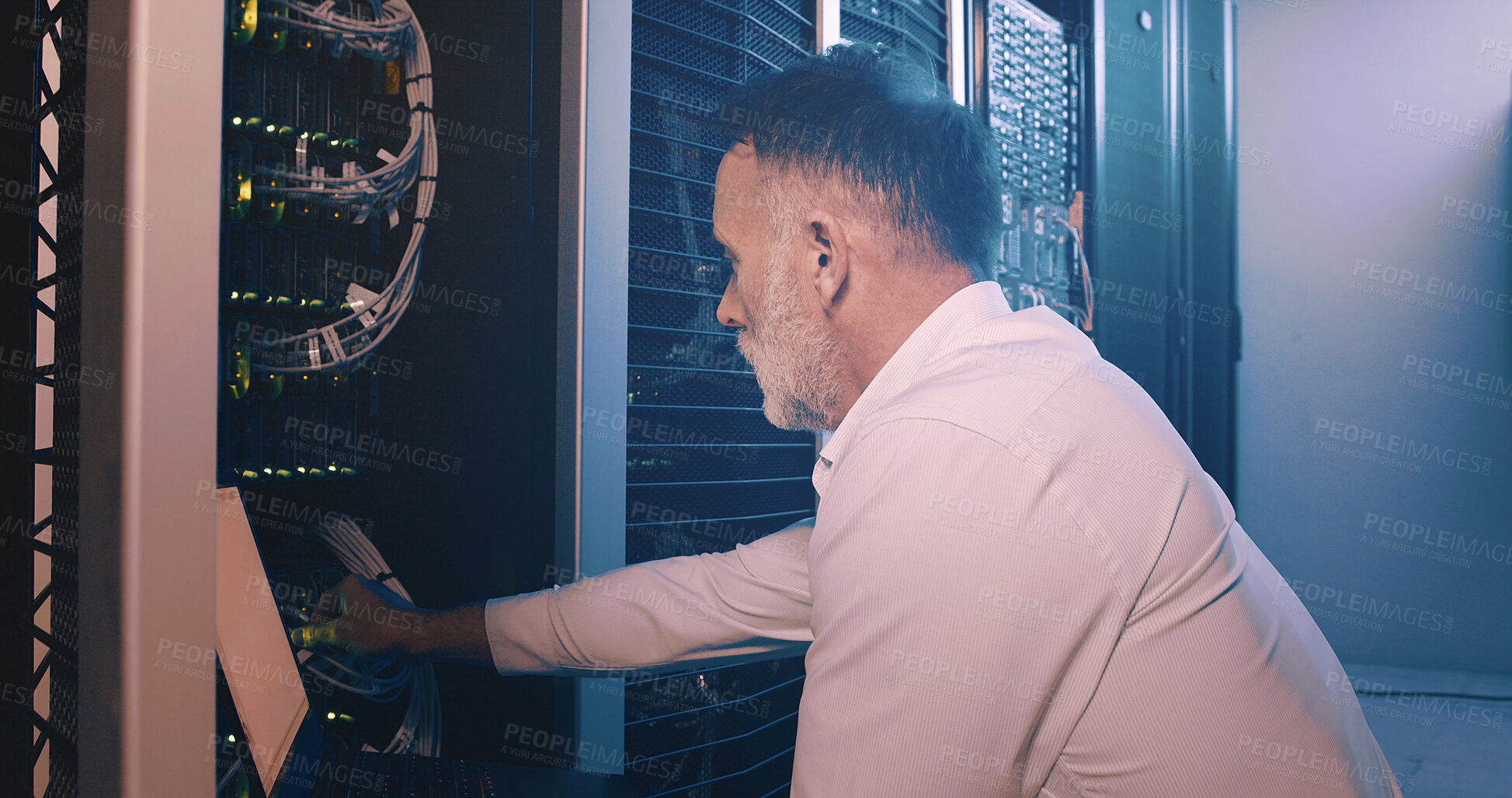 Buy stock photo Engineer, laptop and cable connection at data center for network test, troubleshooting or solution. Mature person, inspection or technology in server room for firewall installation or hardware update