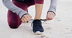 Beach, closeup and hands tie shoes for outdoor run with fitness, health and wellness by seaside. Sports, athlete and woman runner tying laces for cardio, workout and exercise with ocean or nature