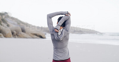 Buy stock photo Fitness, back and woman with stretching on beach to start running, cardio workout and muscle relief. Athlete, person and arm warm up on seashore for getting ready, exercise preparation and training