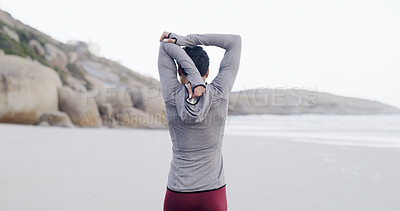 Buy stock photo Exercise, back and woman with stretching on beach to start running, cardio workout and muscle relief. Athlete, person and arm warm up on seashore for getting ready, fitness preparation and training