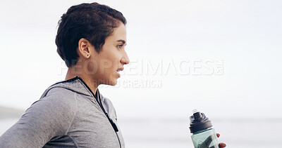 Buy stock photo Fitness, water bottle and woman by ocean for exercise, training and cardio workout in nature. Space, thinking and person with liquid, minerals and nutrition for running, sports and hydration outdoor