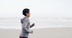 Running, ocean and fitness with woman at beach for health, cardio workout and sports training. Marathon practice, exercise and runner challenge with person outdoor for space, athlete and wellness