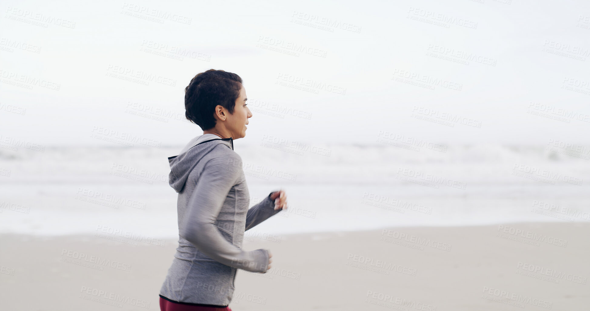 Buy stock photo Running, ocean and fitness with woman at beach for health, cardio workout and sports training. Marathon practice, exercise and runner challenge with person outdoor for space, athlete and wellness