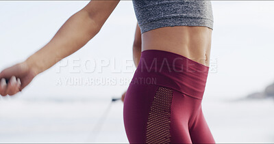 Buy stock photo Body, fitness and skipping with woman on beach for cardio training or sports workout in morning. Exercise, jump rope and stomach with athlete person outdoor at ocean or sea for health challenge