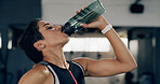 Drinking water, health and relax with woman in gym for workout recovery, electrolytes and fitness. Hydration, exercise and detox with female person in sports club for bottle, wellness and training