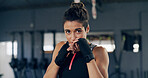 Woman, training and gloves for martial arts at gym, guard and confidence with technique for fight. Person, athlete and portrait with combat sports, exercise and workout at fitness club in Colombia