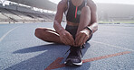Athlete, hands and tie shoes on track for marathon practice, running comfort and start race workout. Runner, woman and fasten shoelace on ground for sports performance and getting ready for exercise