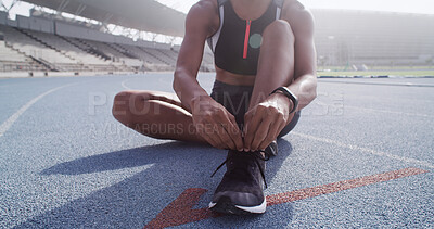 Buy stock photo Athlete, hands and tie shoes on track for marathon practice, running comfort and start race workout. Runner, woman and fasten shoelace on ground for sports performance and getting ready for exercise