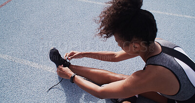 Buy stock photo Laces, shoes and woman on race track for fitness, sports and prepare for practice run outdoor. Female person, runner or athlete with sneakers for training, start exercise or workout at stadium