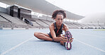 Stretching, sports and woman on track in stadium to start running, exercise and marathon training. Athlete, fitness and person with leg warm up for workout, race competition and challenge outdoor
