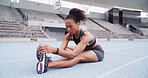 Stretching, exercise and woman on track in stadium to start running, fitness and marathon training. Athlete, fitness and person with leg warm up for workout, race competition and challenge outdoor