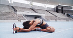 Athlete, woman and stretching for fitness, stadium and preparing for exercise, warm up and training. Outdoor, runner and workout routine for wellness, healthy and person on race track for sport