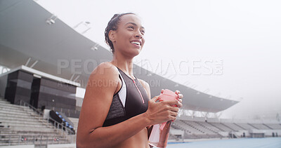 Buy stock photo Happy, sports and woman with water in stadium for exercise, training and workout on running track. Fitness, athlete and person with drink, bottle and thirsty for wellness, health or hydration outdoor