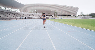 Buy stock photo Back, stadium and woman running for sports, exercise and practice for fitness outdoor. Race track, runner and athlete sprint for athletics training, workout or energy with cardio challenge at space