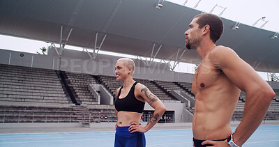 Buy stock photo Athlete, man and woman at track, tired and rest with smile, breathing and workout for fitness at arena. People, team and runner on break, happy and exhausted with training routine at sports stadium