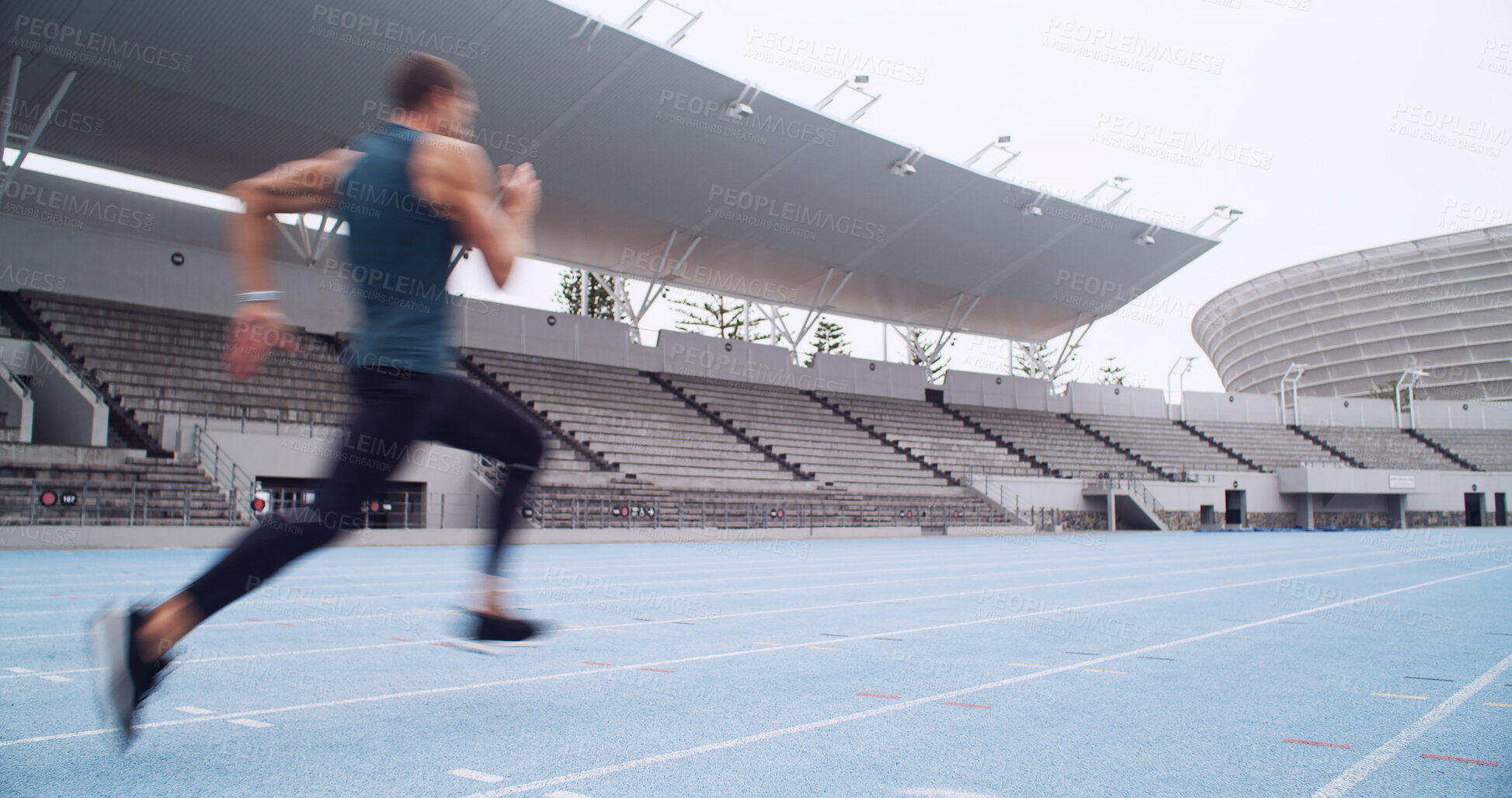 Buy stock photo Man, athlete and sprint at track, stadium and practice for competition with motion blur, speed or exercise. Person, runner and outdoor at arena for training, workout and fitness at sports club
