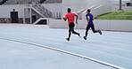 Back, men and running a race at stadium for competition workout, speed training and performance. Athletes, runner and sprint on track for fitness event, sports challenge and marathon with endurance