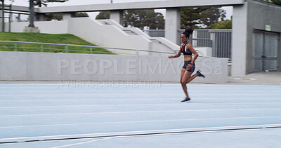 Buy stock photo Athlete, runner and woman on race track with speed for fitness, training and cardio performance. Sprinter, motion or fast female person with running at stadium space for sports, practice and exercise