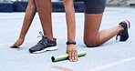 Hands, relay and person on race track for run, start or ready for challenge with fitness for competition. Sports, athlete and baton for contest, practice or launch for cardio exercise at stadium