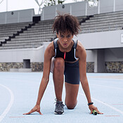 Hands, relay and girl in portrait on race track for run, start or ready ...