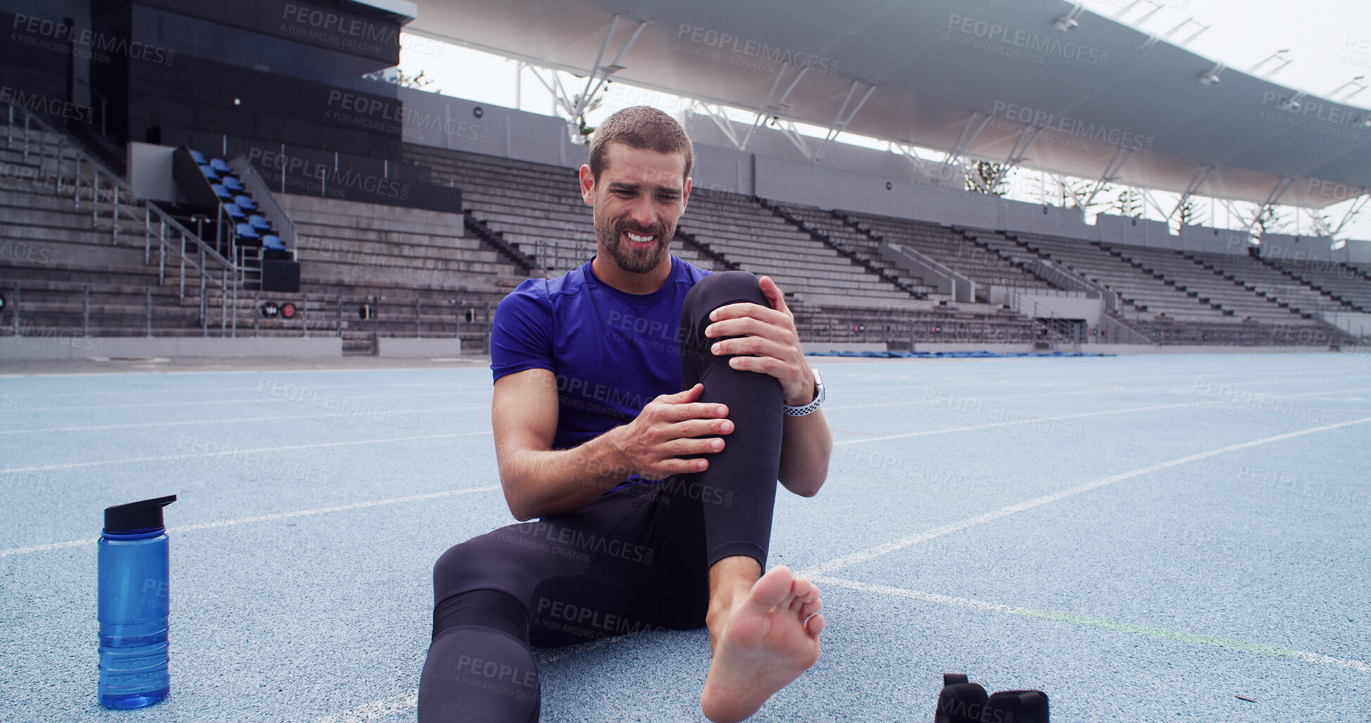 Buy stock photo Pain, track and man with training, leg and joint injury with muscle tension, bruise and wellness. Athlete, outdoor and person on ground, medical emergency and workout with fitness and inflammation