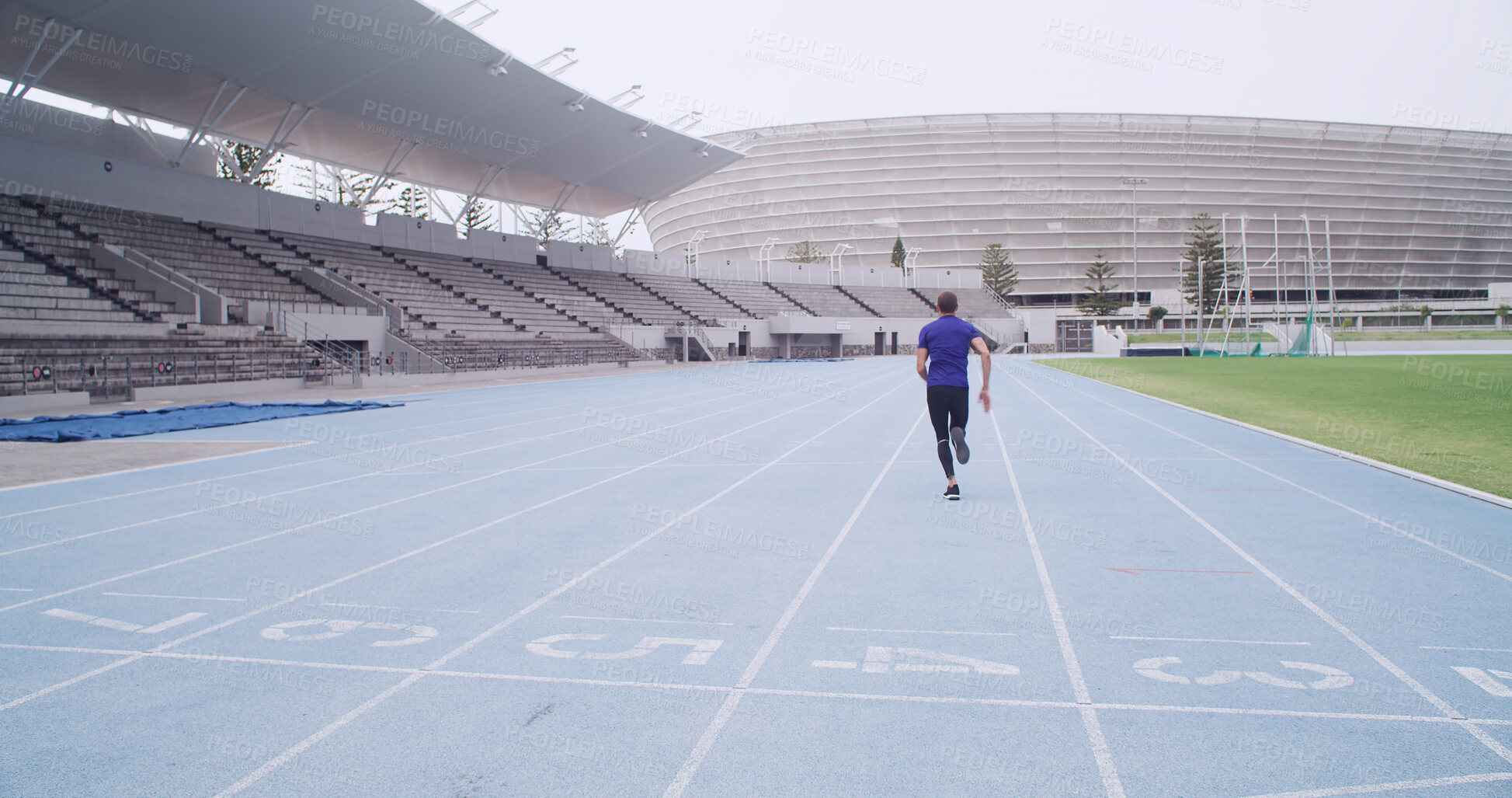 Buy stock photo Runner, athlete and back at stadium for sports competition, sprint or fitness practice. Training, speed and person outdoor as track running, marathon and space for workout and wellness in lane