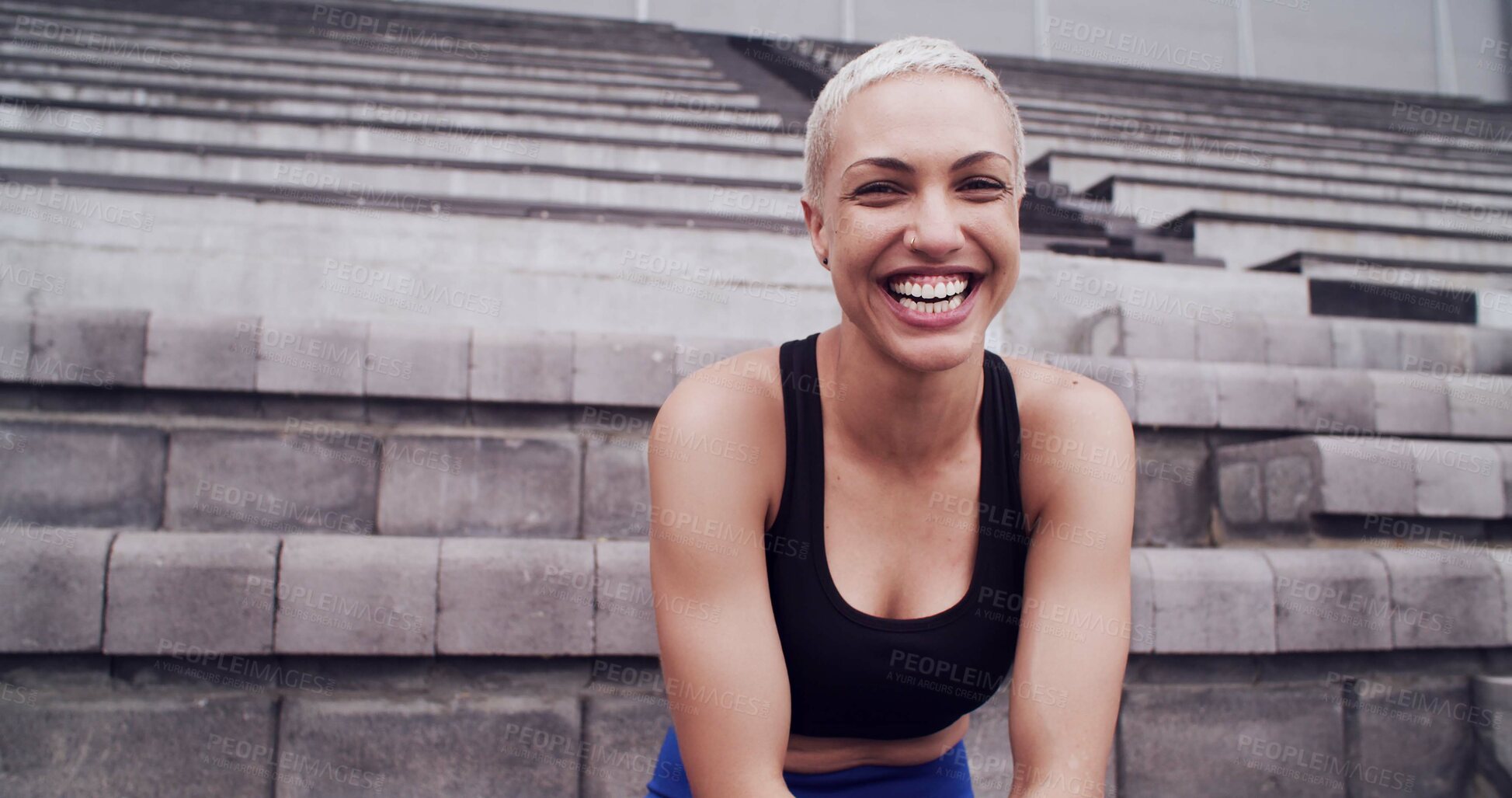 Buy stock photo Break, laughing and portrait of woman on stadium bleachers for fitness, training or workout as athlete. Competition, exercise and sports with funny runner at arena or venue for event or tournament