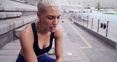 Buy stock photo Athlete, woman and tired with breathing at stadium for running recovery, workout fatigue and rest. Runner, girl and exhausted with break on stairs for training challenge, burnout and fitness exercise