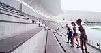 Athlete, people and getting ready on stairs at stadium for fitness, exercise and marathon practice. Group, women and training on steps for endurance routine, sports workout and challenge preparation