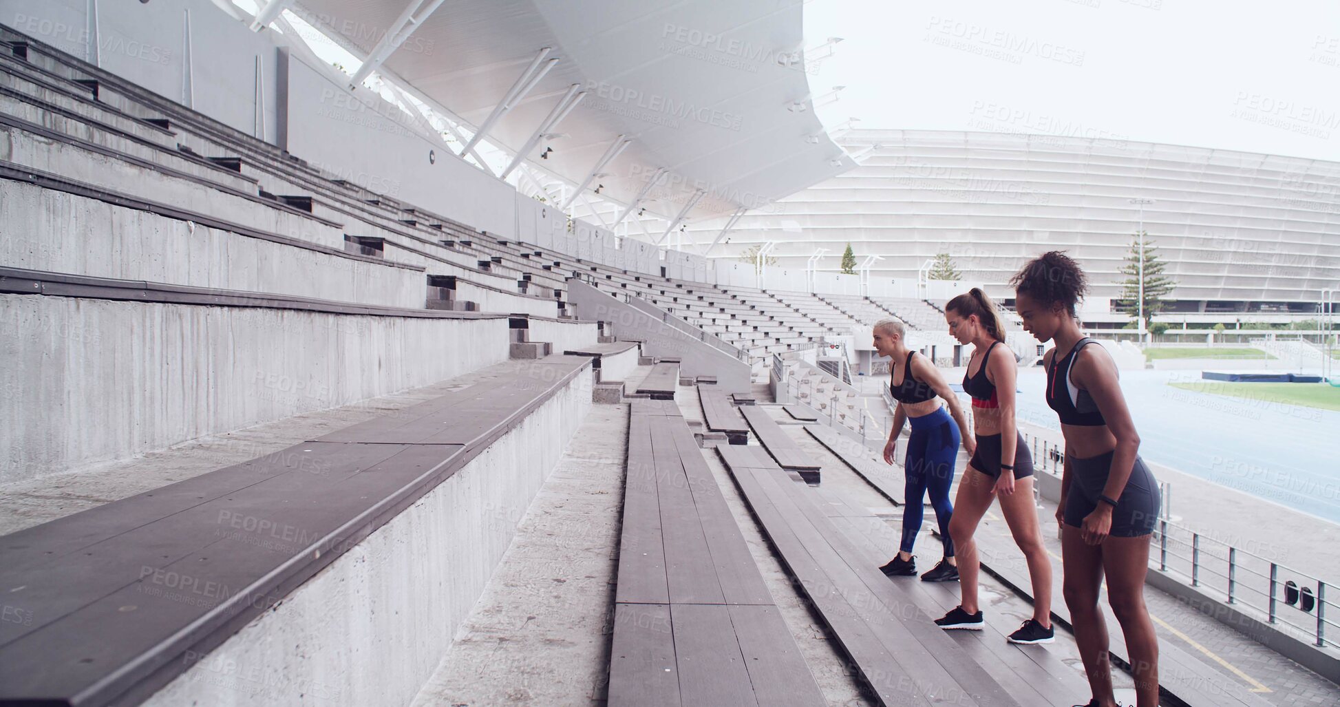 Buy stock photo Athlete, people and getting ready on stairs at stadium for fitness, exercise and marathon practice. Group, women and training on steps for endurance routine, sports workout and challenge preparation