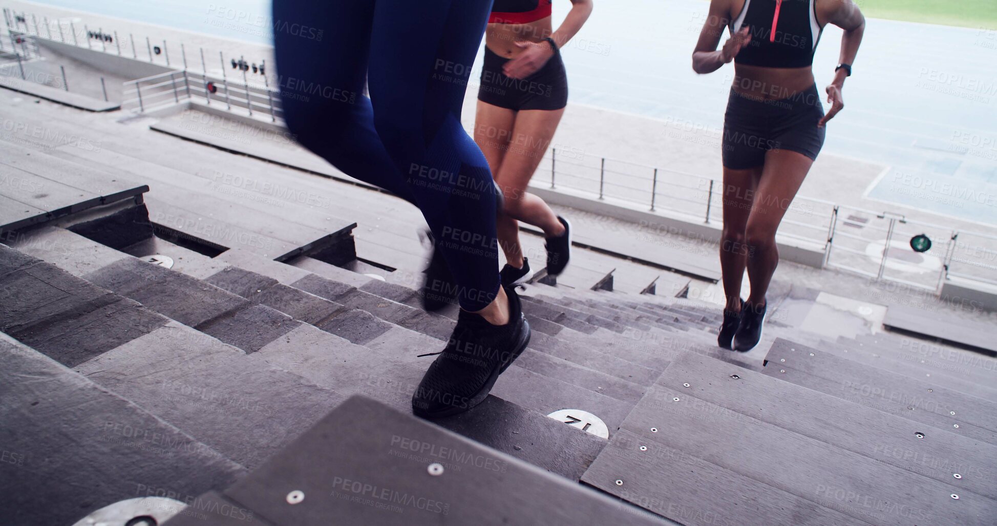 Buy stock photo People, legs and running on stairs at stadium for fitness, cardio exercise and marathon practice. Athlete, women and training on steps for endurance, sports workout and preparation for tournament