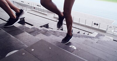 Buy stock photo Legs, people and running on stairs at stadium of fitness, cardio exercise and marathon practice. Athlete, person and training on steps for endurance routine, sports workout and challenge preparation