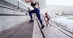 Athlete, people and running on stairs at stadium for fitness, cardio exercise and marathon practice. Group, women and training on steps for endurance, sports workout and preparation for competition