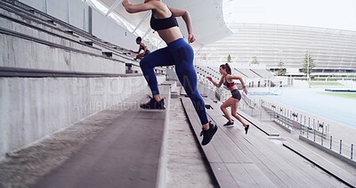 Buy stock photo Athlete, people and running on stairs at stadium for fitness, cardio exercise and marathon practice. Group, women and training on steps for endurance, sports workout and preparation for competition