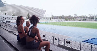 Buy stock photo Smile, athlete and people talk at stadium for planning, fitness break and competition advice. Women, relaxing and friends discussion for exercise, training tips and race feedback of sports tournament