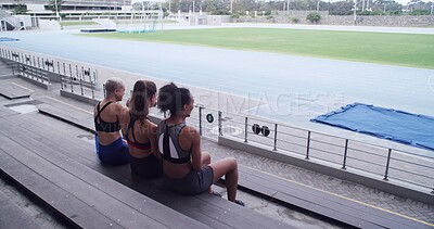 Buy stock photo Above, athlete and people on bench at stadium for planning, fitness break and competition advice. Back, women and friends discussion for exercise, training tips and race feedback of sports tournament