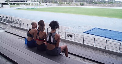 Buy stock photo Smile, athlete and people on bench at stadium for planning, fitness break and competition advice. Back, women and friends discussion for exercise, training tips and race feedback of sports tournament